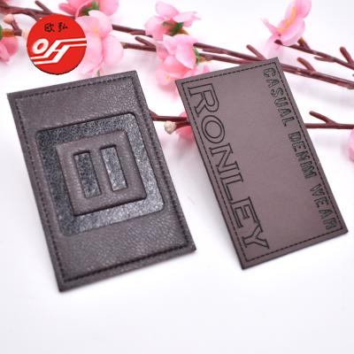 China Sustainable Hot Press Super Fiber Embossed Leather Patch Label With Expanded Name for sale