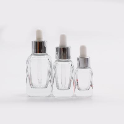 China Cosmetic 10ml 20ml 30ml 40ml clear french square glass dropper bottle with silver ring for sale