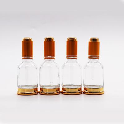 China 30ml essential oil cosmetic glass bottle with push button dropper, glass dropper bottle with thick metal bottom for sale