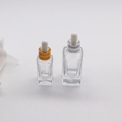 China Wholesale Gold Cosmetic Clear Square Top Factory Price Dropper Glass Bottle 30ml 50ml for sale