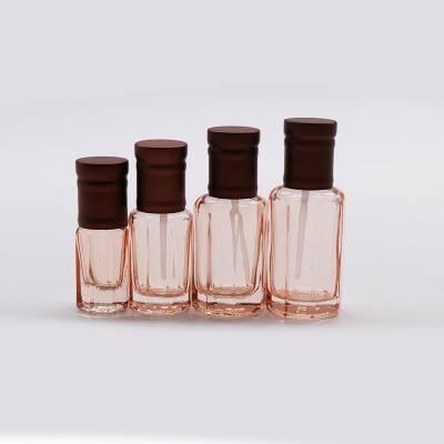 China 3ml Pink Octagon Cosmetic Essence Perfume Essential Oil Rollball Glass Bottles With Metal Lids for sale