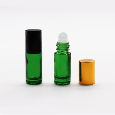 China Custom Personal Care 5ml 10ml Round Green Roll On Perfume Glass Bottle With Roller On for sale