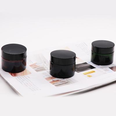 China Empty glass jar 20g 30g 50g cosmetic amber green black color face cream jar for sale