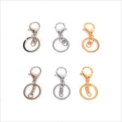 China Luggage Accessories Wholesale Cheap Custom Gold Double Key Ring Metal Key Chain for sale