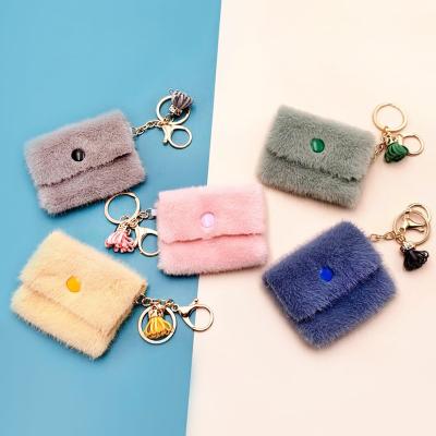 China New classic creative female mini cute wallet headphone key chain plush gift key bag pendant for sale