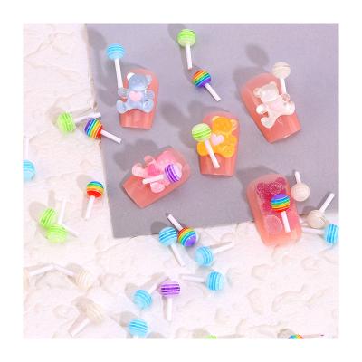 China Healthy Easy Apply Non-Toxic Light Decoration Lollipop Candy Wholesale Nail Charm Decor Magic Design Candy 3d Nail Art Creative 3d Nail Art for sale