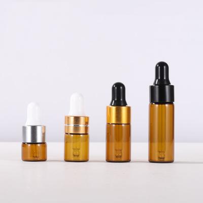 China 1ml 2ml 3ml 5ml Essential Oil Dropper Cosmetic Packaging Bottle Amber Glass Bottles for sale