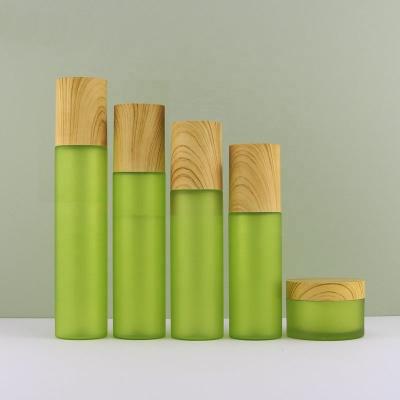 China 100ml 110ml 120ml 150ml 50g Cosmetic Empty Plastic Green Cosmetic Skin Care Bottle Refillable Set for sale