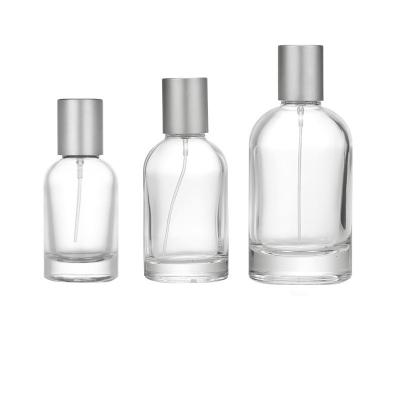 China 30ml 40ml 50ml 100ml Spray Perfume Glass Cosmetic Luxury Bottle With Metal Lid for sale