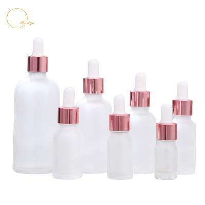 China Personal skin care packaging custom logo 5ml 10ml 15ml 30ml 50ml rose gold essential oil dropper bottle frosted glass cosmetic apackaging for sale