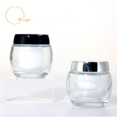 China Gold Cap Silver Black Cosmetics Luxury Glass Cream Jar 50g Body Cream Containers Face Cosmetics for sale