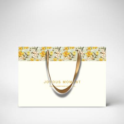 China Recycled Materials Wholesale Custom Recycled Paper Shopping Bag Logo Wholesale For Clothes Customer Custom Packaging for sale