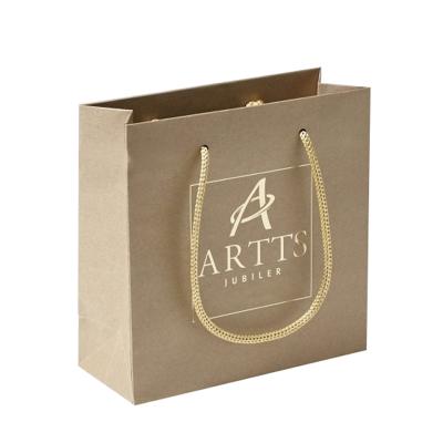 China Custom Made Custom Printing Recycled Materials Trendy Style Logo Kraft Paper Shopping Bags With Ribbon Handle for sale