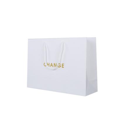 China Economic Modern Recycled Materials Apparel Packaging Recycle Shopping Bag Gift Paper Gold Stamping Logo Paper Bag for sale