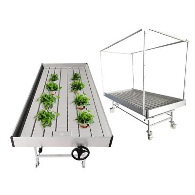 China Long Size Greenhouse Irrigation Wheel REFLUX ABS Flood Nursery Tray Movable Rolling Bench With Trellis for sale