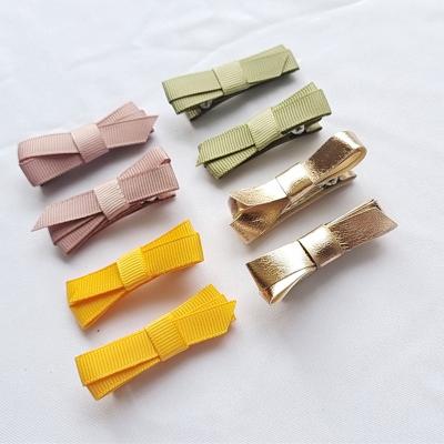 China Handmade Soft Decoration Fabric Grosgrain Ribbon Small Hair Bow with Clips for Baby Hair Accessories Kids Cute PU Gold Hair Clips for sale