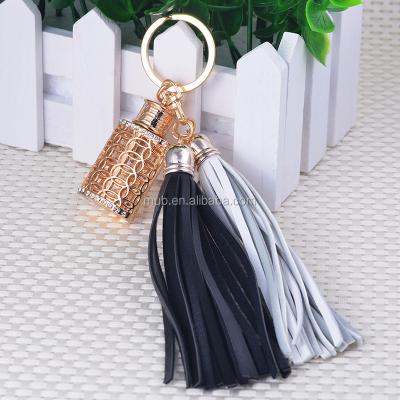 China Essential Oil Mub New Leather Tassels Bow Bell Key Chain Oil Fragrance Key Chain Charms Plug Pendant Ring for sale