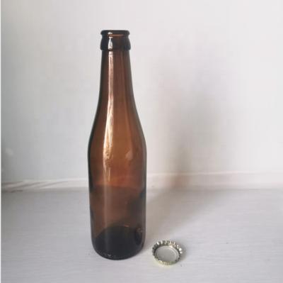 China Amber Green Beer Packaging Glass Beverage Bottle With Crown Lid Beer Bottle 330ml 500ml for sale