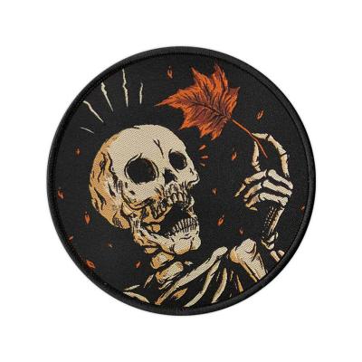 China Sustainable Halloween Skull Pattern Iron On Appliqued Custom Merrow Woven Apparel Patches for sale