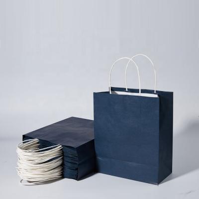 China Disposable Custom Logo Color Shopping Clothing Handle Gift Kraft Paper Craft Packing Blue Paper Bag for sale