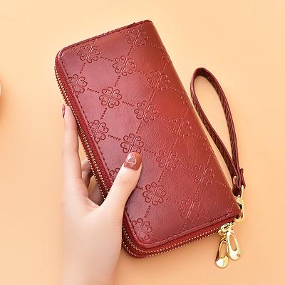 China Double zipper handbag large capacity double-layer mobile phone wallet waterproof women's European luminous leather bag for sale