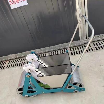 China Hand push type new type garlic seeder 2rows garlic planter manual seed planting machine for sale