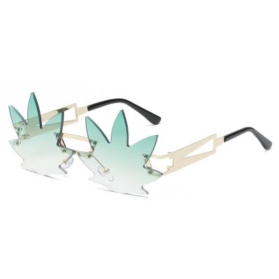 China Fashion Metal Grass Frame Rimless Sunglasses Metal Frameless Custom Logo Maple Leaves Sun Glasses For Women And Men 3499 for sale