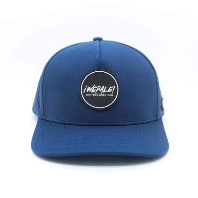 China Unisex Custom Navy Blue Baseball Cap mit PVC Gummi Patch Logo und wasserdichtem Design zu verkaufen