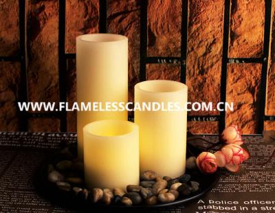 China Ivory Wax Straight Edge Flameless LED Candles With Rock and Round Plastic Tray for sale