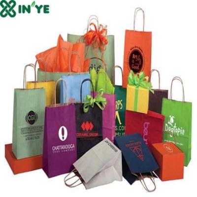 China Wholesale Disposable Eco-Frinedly Stylish Foil Stamping Logo Paper Gift Bag for sale