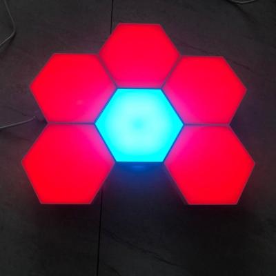 China Modern Multi-colors Hands Touch Sensing Modular Night Light Family Quantum Hexagonal Black Honeycomb Induction Wall Lamp for sale