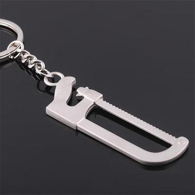 China Souvenir Manufacturer Direct Selling Korean Version Saw Couple Tool Spoon Metal Key Chain Key Chain for sale