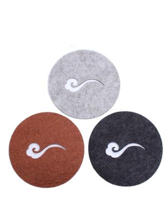 China Heat Insulation Viable Felt Absorbent Coaster Hollowed Out Xiangyun Ruyi Tea Art Coaster Place Mat Circular Health Pot Felt Coaster for sale