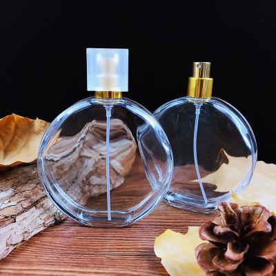 China Wholesale 50ml 100ml Personal Care Atomizer Round Glass Empty Perfume Bottle With Cap for sale