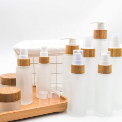 China Essential Oil 2022 Stock Frosted Empty Perfume 50ml Glass Bottles With Wooden Screw Cap for sale