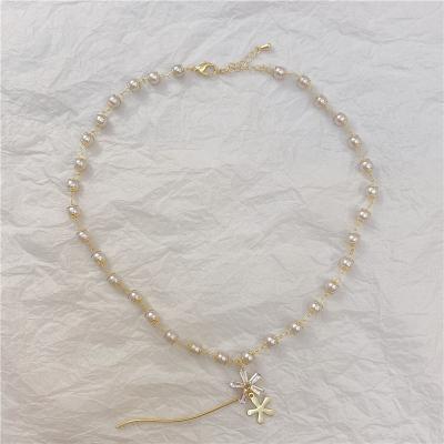 China New Casual/Sporty Japan Pearl And South Korea Metal Zircon Female Letter Clavicle Chain Flower Pendant Necklace for sale