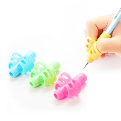 China Write Pencil Silicone Grip For Children Writing Rubber Fingertip Kids Wholesale Set Left Handed Pen Silicon Sleeve Grips for sale