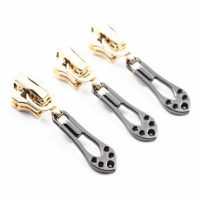 China Custom Rainbow Color Metal Nickel Free Exquisite Slider Zipper Pulls Creative Pattern Zipper Puller Nylon Head for sale