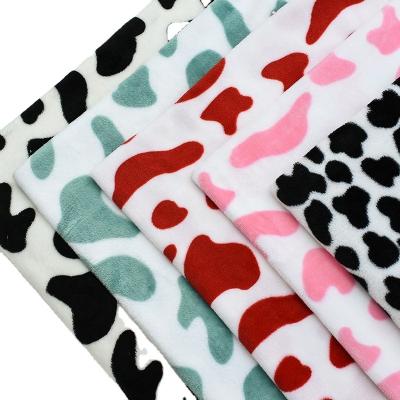 China Antistatic 100% Cash Cow Grain Print Fleece Polyester Flannel Fabrics For Blankets for sale