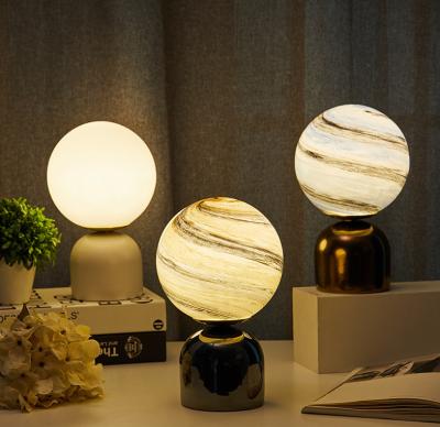 China New-designed creative unique gift bedroom atmosphere starry sky mood table glass ball planet planet night glowing magic lights with marble base for sale