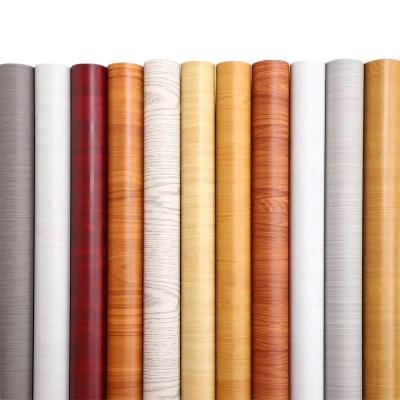 China PVC 3d waterproof self-adhesive wood grain wallpaper roll waterproof and wear-resistant wallpaper for furniture decoration for sale