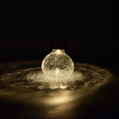 China Automatic Light Control Charging During The Day Warm White Glass Fairy Led Crack Jar Solar Outdoor Christmas Garden Lights Decorative for sale