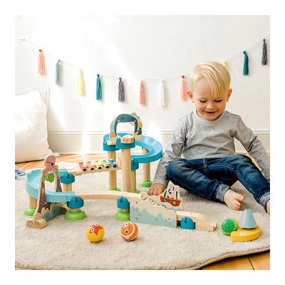 China Wooden Slot Toy Montessori Pipe Building Blocks Toy Large Family Assembled Ball Track Building Block Music Slide Building Blocks for sale