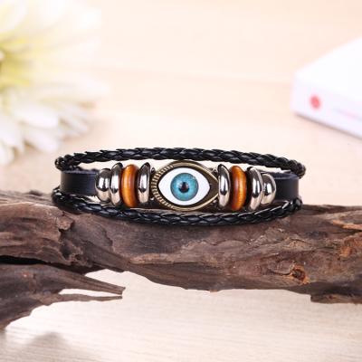 China Handwoven Retro Eye Bangle Bracelet Jewelry Exotic Multilayer Adjustable Leather Beaded Eyeball Bracelet for sale