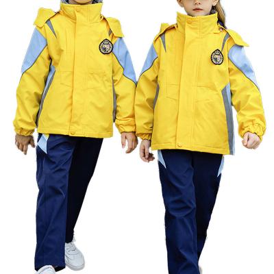 China Customized Design Elementary And Middle School Uniforms Set Yellow Three Pieces School Winter Storm Outdoor Suit for sale