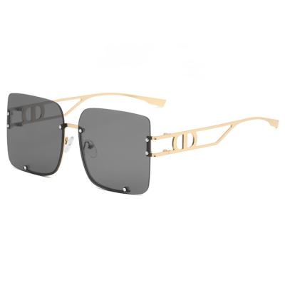 China Fashion sunglasses 2021 hollow leg D series gradient lens fashion trend metal sunglasses new retro metal frameless for sale