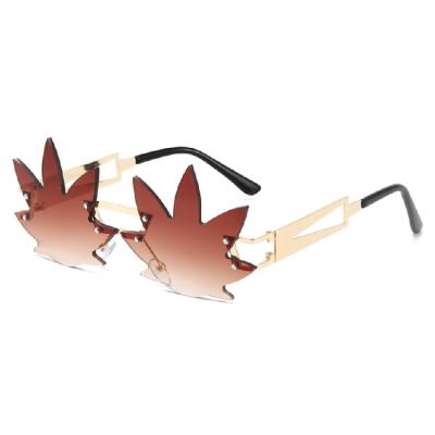 China Maple Leaf Sunglasses Wholesale New Maple Leaf Modeling Retro Frameless Cut Edge Street Photo Glass Sunglasses for sale