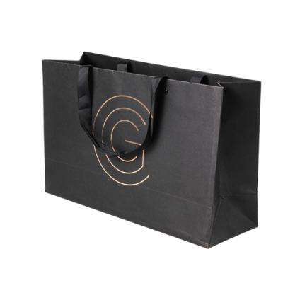 China Hot Sale Recycled Materials Logo Handle Paper Packaging Bag Customized Paper Bag For Clothes for sale