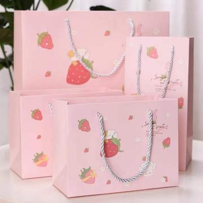 China Boutique Recyclable Hot Selling Custom Shopping Bag Printed Pink Paper Bag With Handle for sale