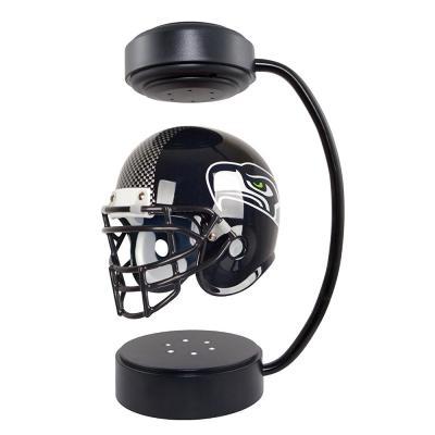 China Anti Gravity NFL American Football Oakland Raiders Helmet 360 Degree Rotating Magnetic Levitation Display Stand for sale